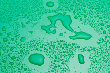 Drops of water on a green surface