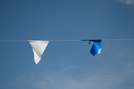 white and blue flah on the  clear blue sky