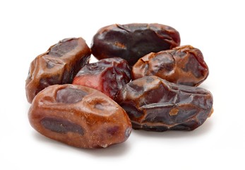 Dried dates on white background.