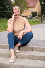 Cheerful young woman talking on phone