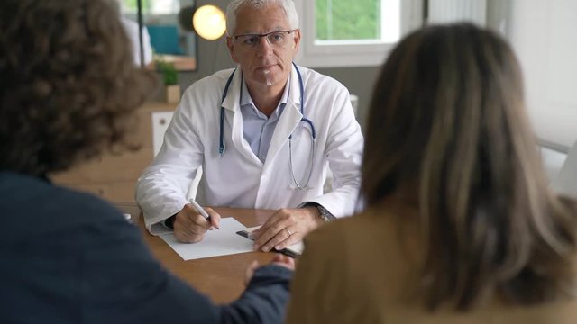 Young couple having an appointment at the doctor's office