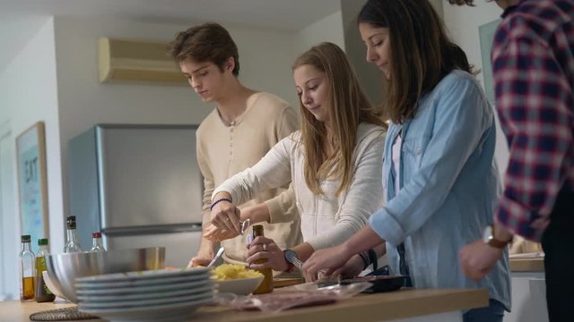 Flatmates cooking together at home