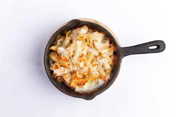Pasta bake with whole wheat penne. isolated on white background