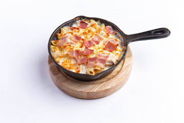 Pasta bake with whole wheat penne. isolated on white background