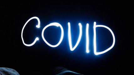 the covid inscription is made by light, at night on a long exposure (freezelight)