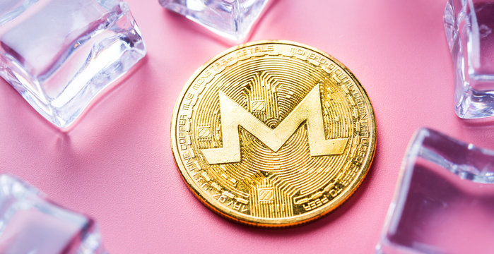 GoldenMonero XRM on light background Close-up, macro shot. New Virtual Money