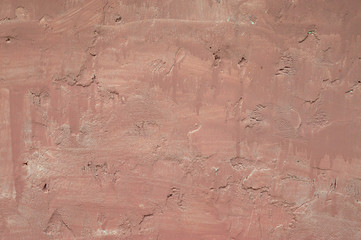 Vintage or grungy pink colored background of natural cement or stone old texture as a retro pattern layout. Stucco texture of the old city wall