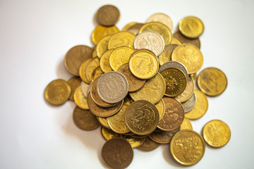 a bunch of Polish coins on a white background close up