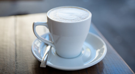 a cup of coffee on the table
