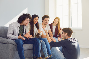 A group of friends talking in a room.