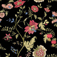 Seamless pattern with stylized ornamental flowers in retro, vintage style. Jacobin embroidery imitation. Colored vector illustration on black background.