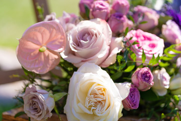 Bouquets of fresh flowers decoration of the festive table. Celebrating an open air party. Decor Details