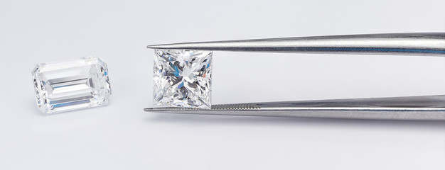 Diamond Shapes Compared. Emerald Cut Diamond and Princess Cut Diamond. 