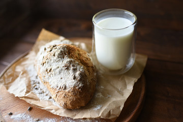 homemade bread with sesame seeds. cook in the kitchen at home during the coronavirus crisis. Stay at home. Enjoy cooking at home. Wholemeal bread. Healthy bread