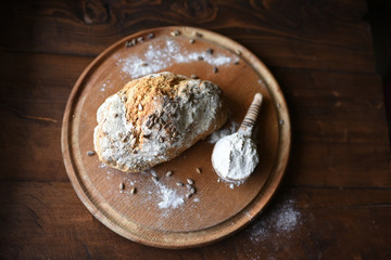 homemade bread with sesame seeds. cook in the kitchen at home during the coronavirus crisis. Stay at home. Enjoy cooking at home. Wholemeal bread. Healthy bread