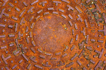 Manhole cover on street, drain cover top view
