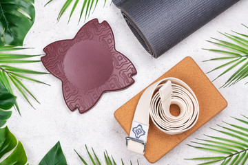 Yoga set accessories on pink background