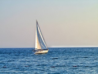 sailboat on the sea at sunset