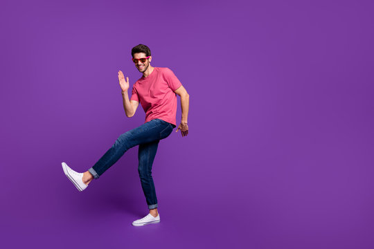 Full Size Photo Of Cheerful Candid Funny Guy Dance Discotheque Enjoy Music Night Club Wear Good Look Outfit Gumshoes Isolated Over Purple Shine Color Background