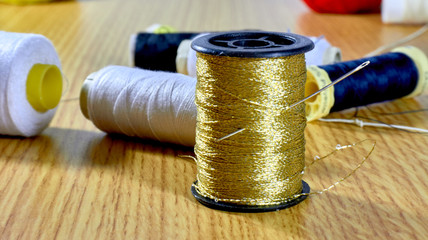 Golden thread with background sewing material