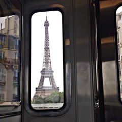 Eiffel Tower Seen Through Glass Window Of Train