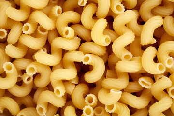 Classic durum wheat pasta isolated on white background. Food and drink concept - various uncooked...
