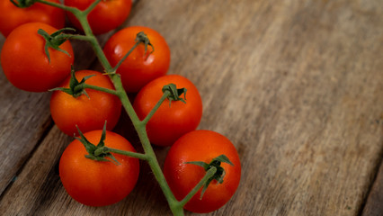 Tomatoes on old wooden background