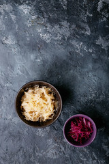 Red and white sauerkraut in ceramic bowl