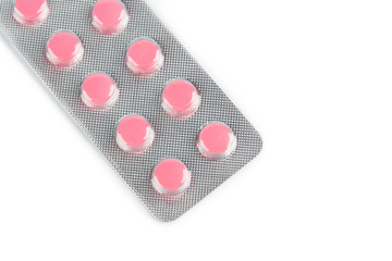 Pills of different colours lay on table. Colorful antibacterials pills, capsules of medicine....