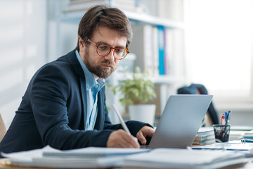 Young businessman working on a laptop