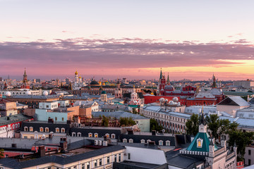 Fototapeta na wymiar View from the central children's world. The Moscow Kremlin. Panorama of Moscow from a height. City at sunset.