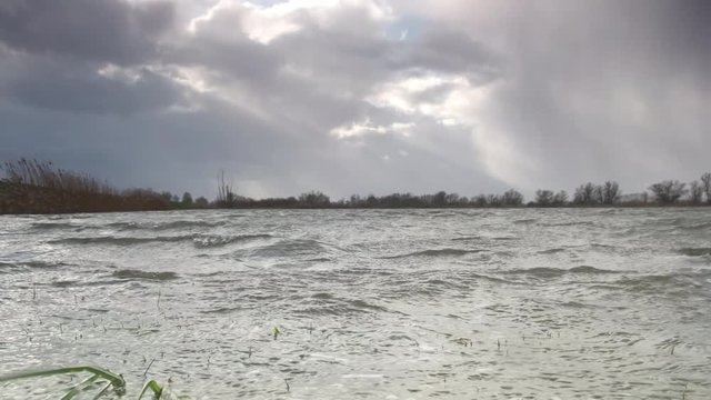 Water running over the floodplains of the river IJssel during flooding caused by high water levels in the river in Overijssel The Netherlands 
