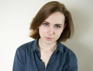 Obraz premium Portrait of a beautiful young woman with blue eyes.