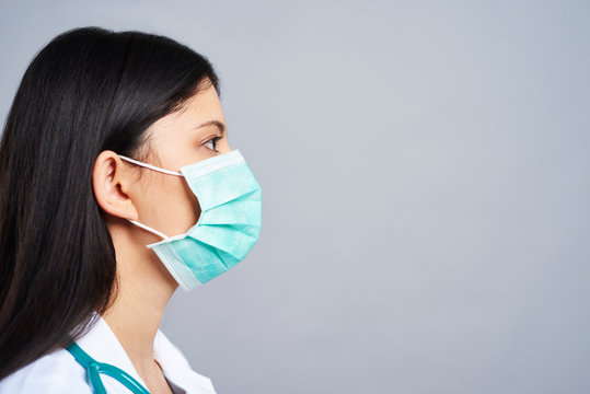 Profile View Of Female Doctor In Studio Shot