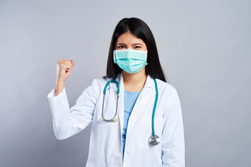 Strong female doctor in studio shot