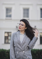  woman posing on city building