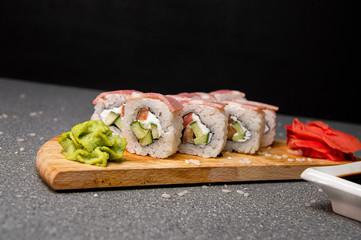 Rolls with ham, cheese and vegetables. Wood surface. Photo for the menu
