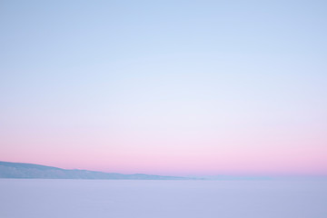 sunset over the winter lake