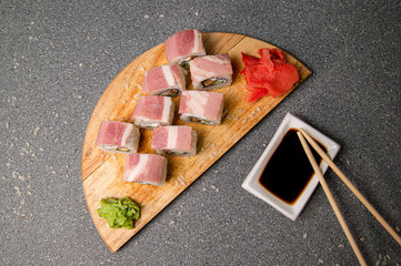 Rolls with ham, cheese and vegetables. Wood surface. Photo for the menu