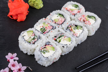 Sushi roll sushi with prawn, avocado, cream cheese, sesame. Sushi menu. Japanese food.