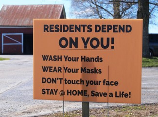 A sign at an American care home during the Covid-19 outbreak says Residents Depend on You to...