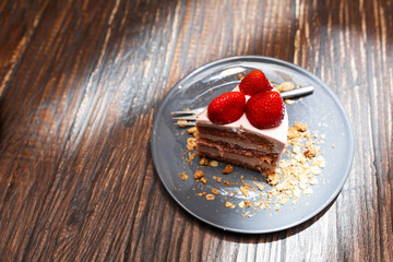 Sweet cakes with summer berries on a wooden table. Party, sweet table. Summer offer desserts in the restaurant.