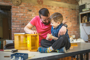 Father and Son Making a Birdhouse