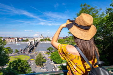 A happy woman enjoying a trip to Budapest in Hungary