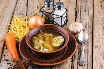 Chicken soup with noodles and vegetables.