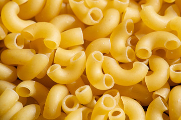 italian dry pasta horns, closeup background scattering, texture