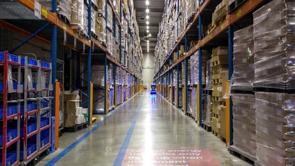 Innovative Futuristic Warehouse Robot working inside Hallway