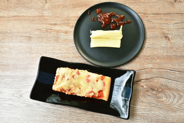 piece of pizza topping sausage and cheese on plate