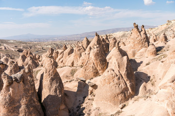 Fototapeta na wymiar Many different rock formations and small fairy chimneys at Devrent Valley in Goreme, Cappadocia,Turkey.