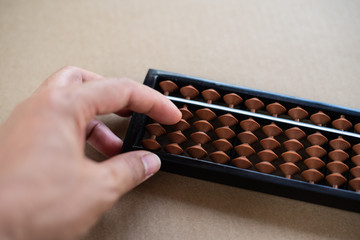 Close up abacus in counting concept.